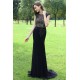 Společenské překrásné černé úzké šaty s tylovým průsvitným kamínky hojně zdobeným topem