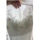 Svatební nádherné bílé šaty s luxusně zdobeným průsvitným živůtkem
