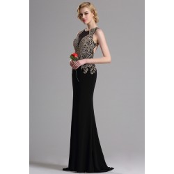 Překrásné a velice elegantní dlouhé černé šaty s plně do zlata kamínky zdobeným topem a svůdným výstřihem na zádech